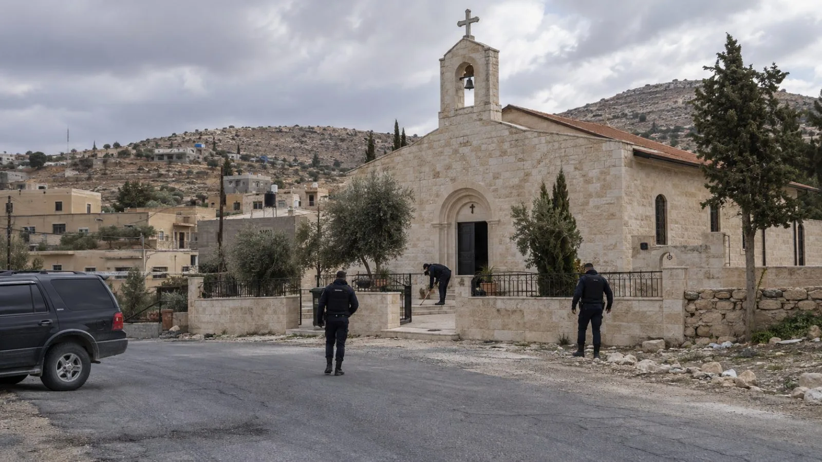 Security officers stand outside a Greek Orthodox church in Hammoud village near Karak, Jordan (AI-generated image / EconoTimes)